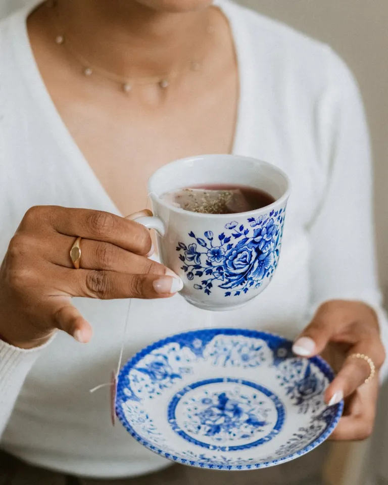 self care tips of a woman holding a cup of tea