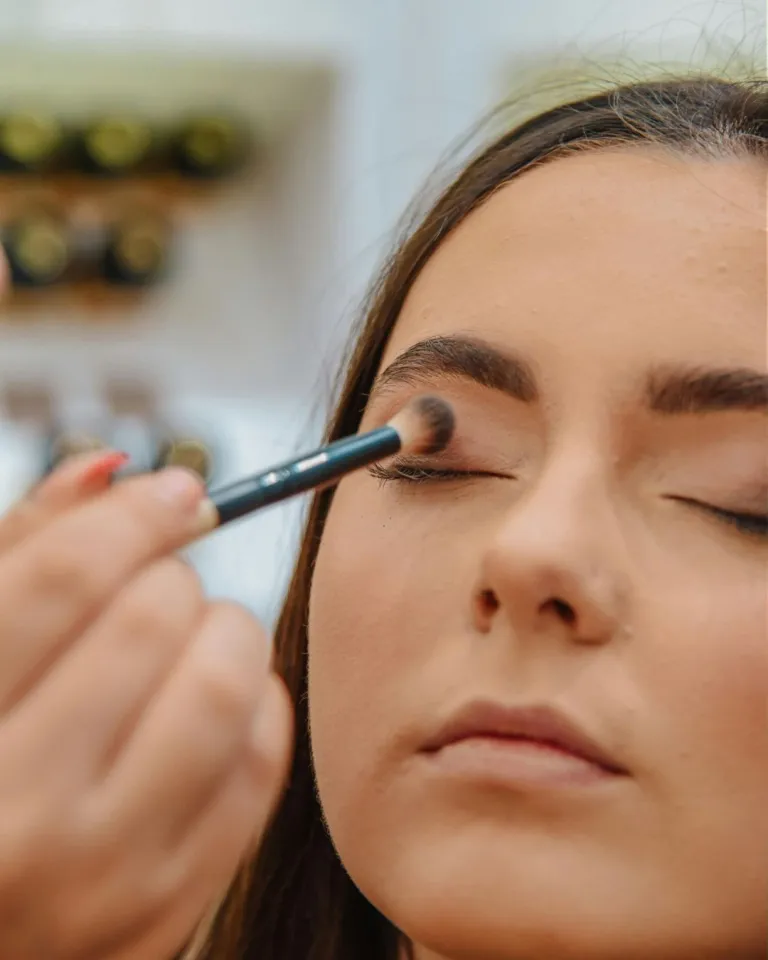 living as christ taught photo of a woman applying make up