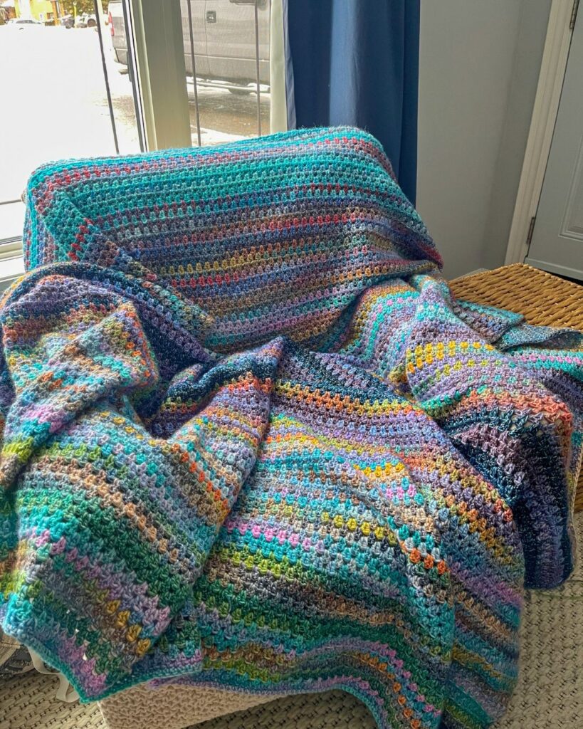 photo of the heirloom blanket wrapped over a chair 