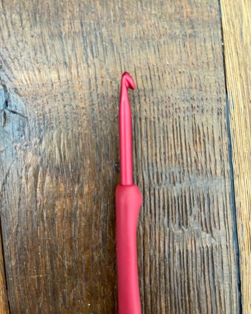 picture of a tulip hook on a wood background