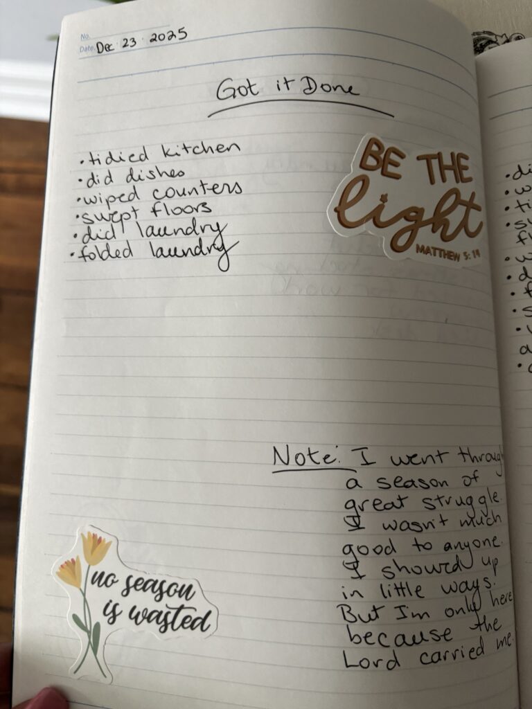 homemaking journal photo of the journal layout with stickers and bullet points